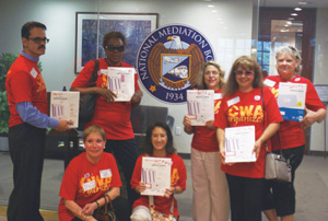 Agents and CWA supporters present mailing labels to NMB