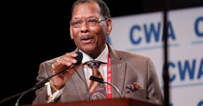 CWA President Claude Cummings speaking into a microphone
