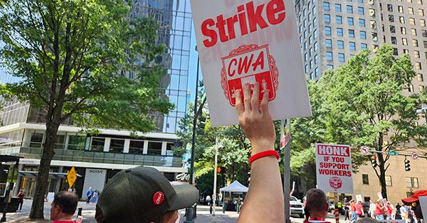 cwa members on strike and holding signs