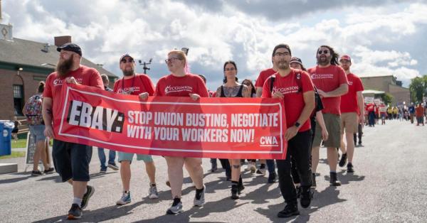 CWAers holding a banner.