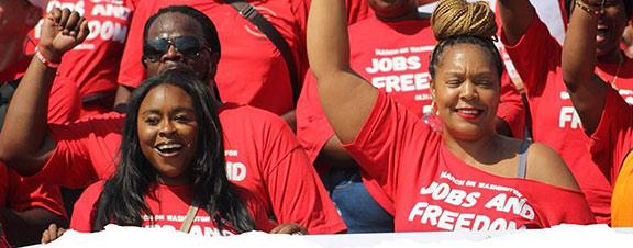 cwa members wearing red at a rally